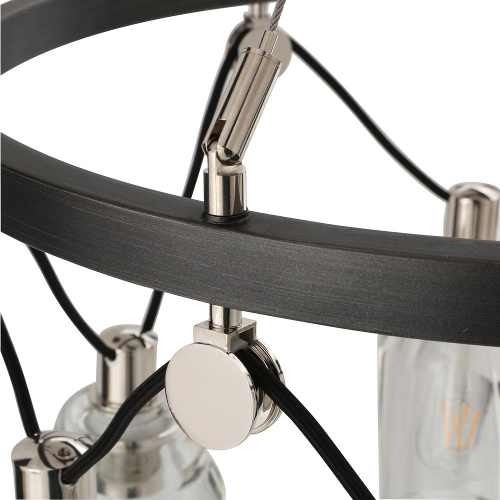 Rustic iron frame supports geometric details and lights at varying heights Rustic iron frame supports geometric details and lights at varying heights