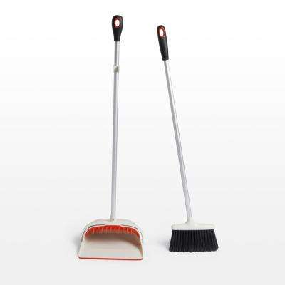 A Woman Sweeping The Floor With A Large Broom Sweep The Floor Lavender Pants Broom
