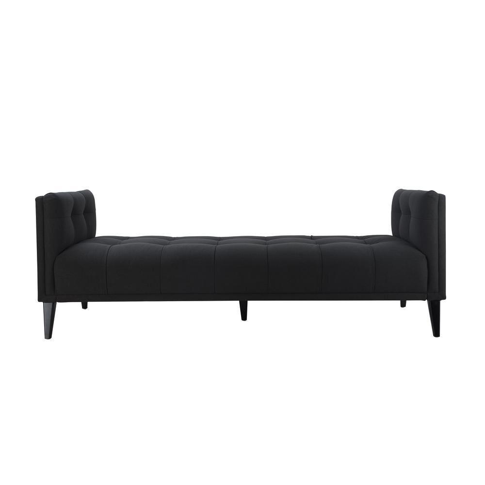 Black tufted sofa