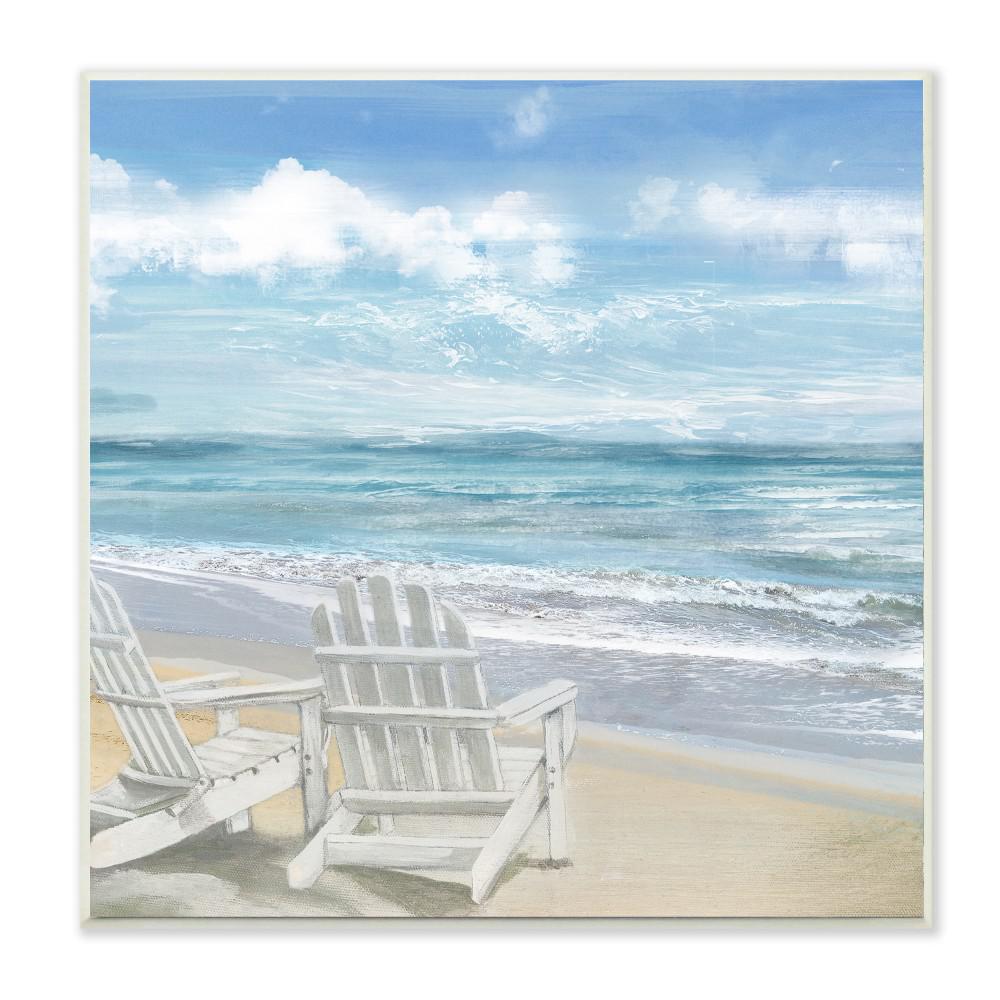 paintings of adirondack chairs on the beach