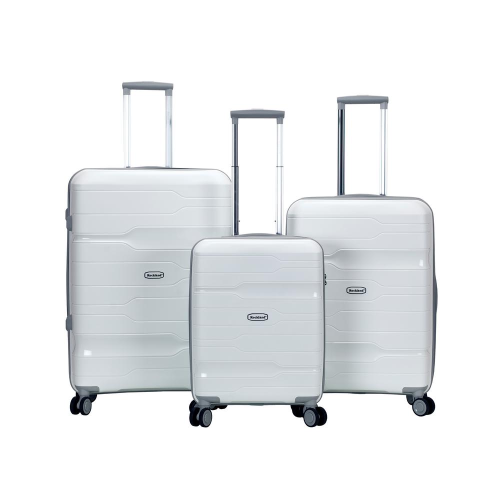 white hardside luggage