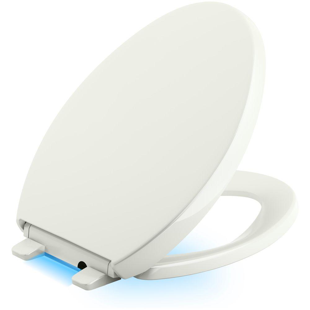 KOHLER Reveal LED Nightlight Elongated Closed Front Toilet Seat in Dune