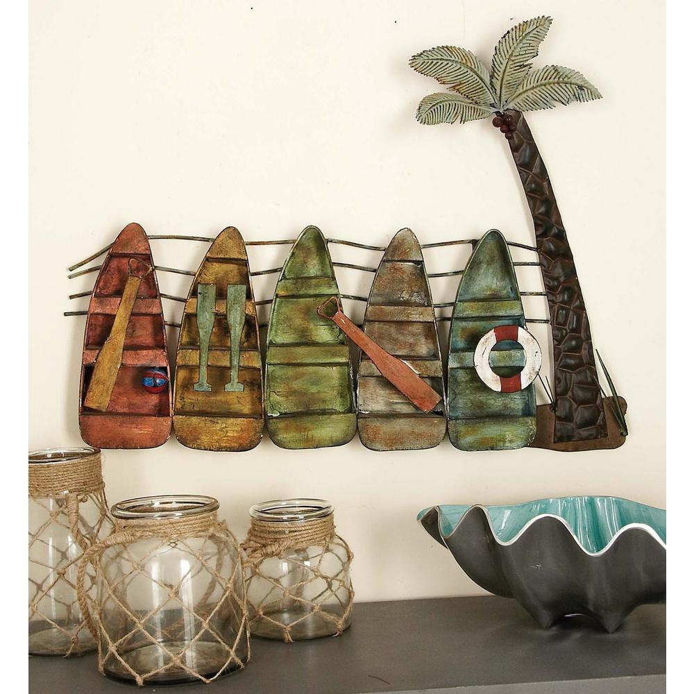 30 in. x 23 in. coastal inspired canoe and palm tree metal