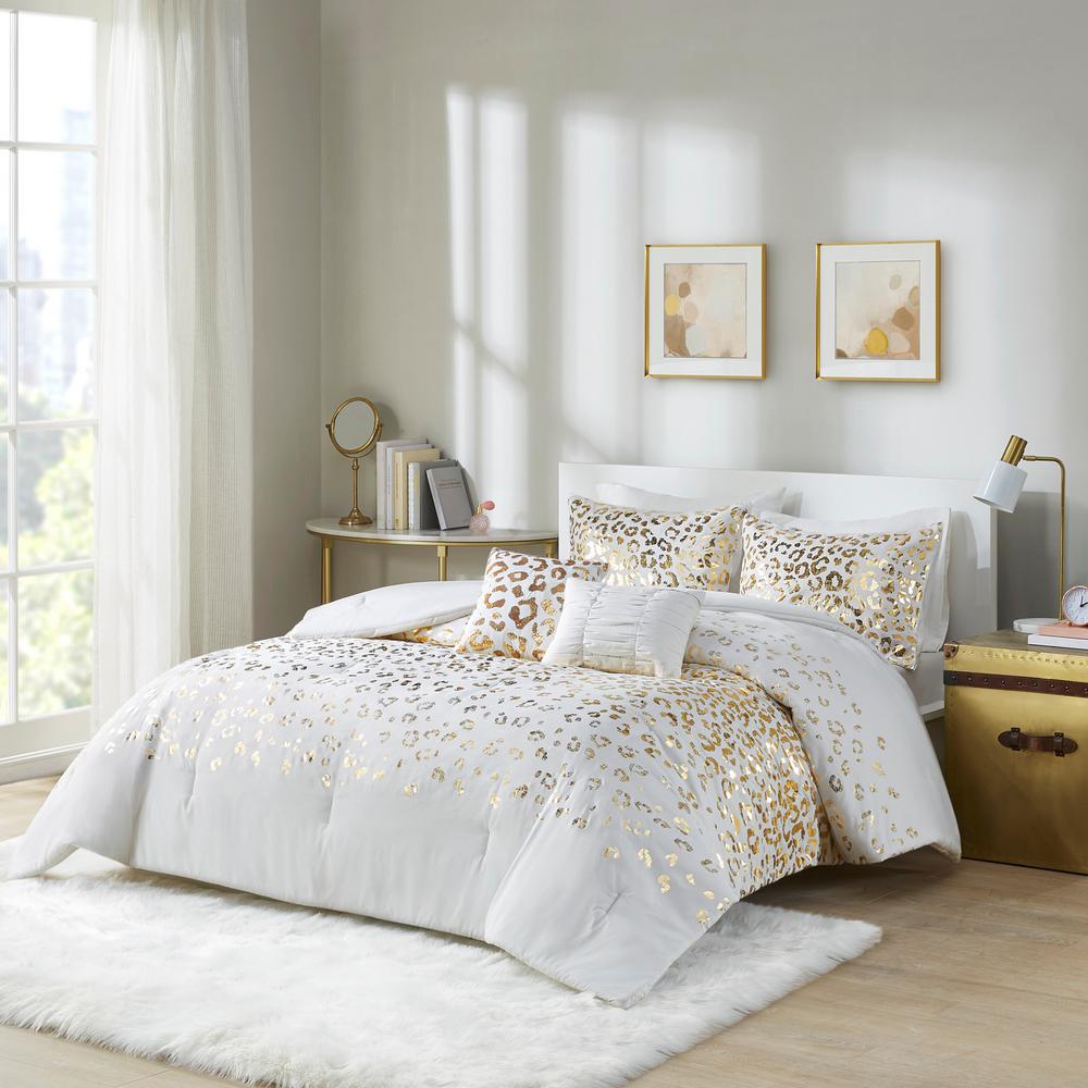 white comforter with gold trim