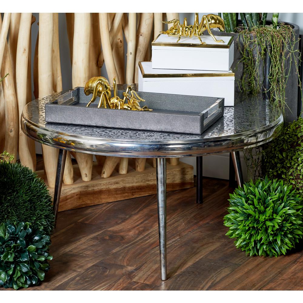 Litton Lane Silver Round Stencil Designed Coffee Table With Black Litton Lane Silver Round Stencil Designed Coffee Table With Black Accents
