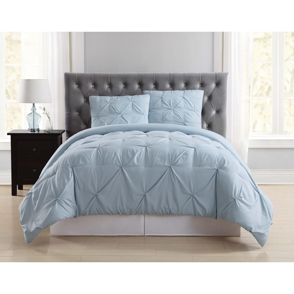 pale yellow and white and light blue comforter