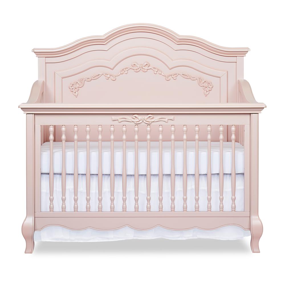 pink crib with changing table