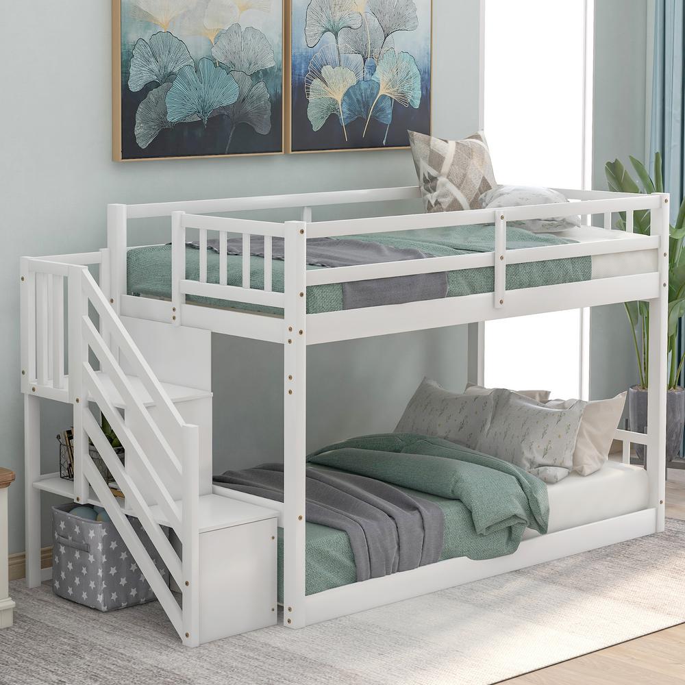 twin bunk beds with stairs and storage