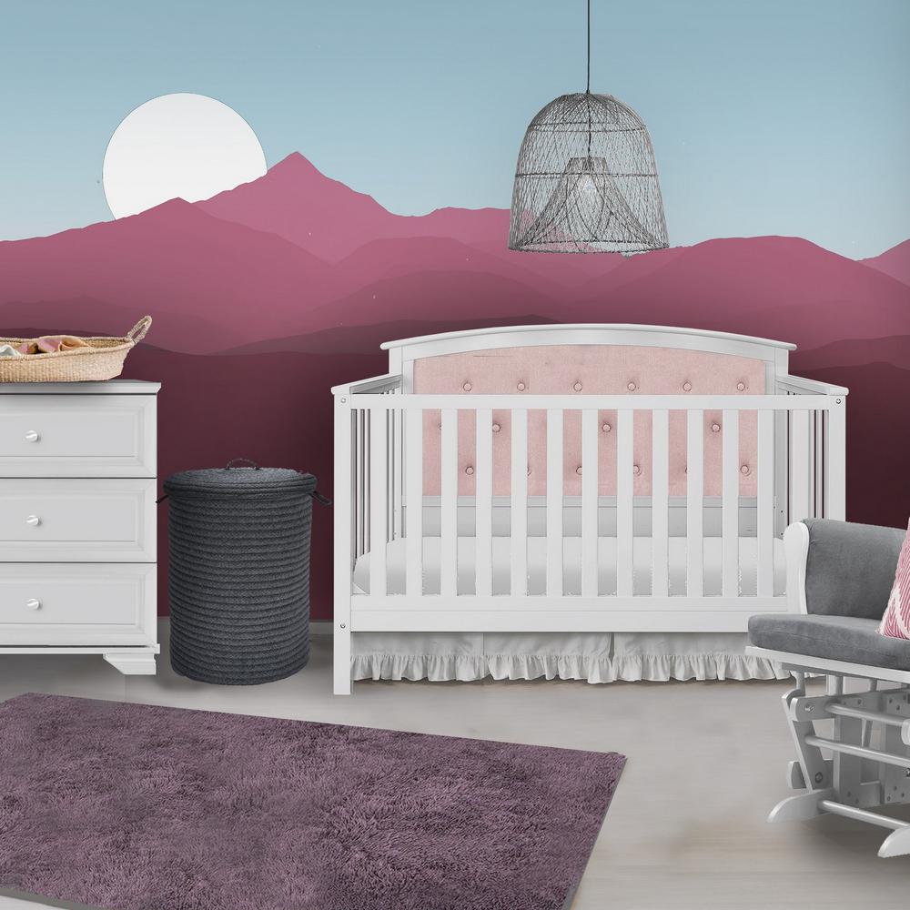 white and pink crib