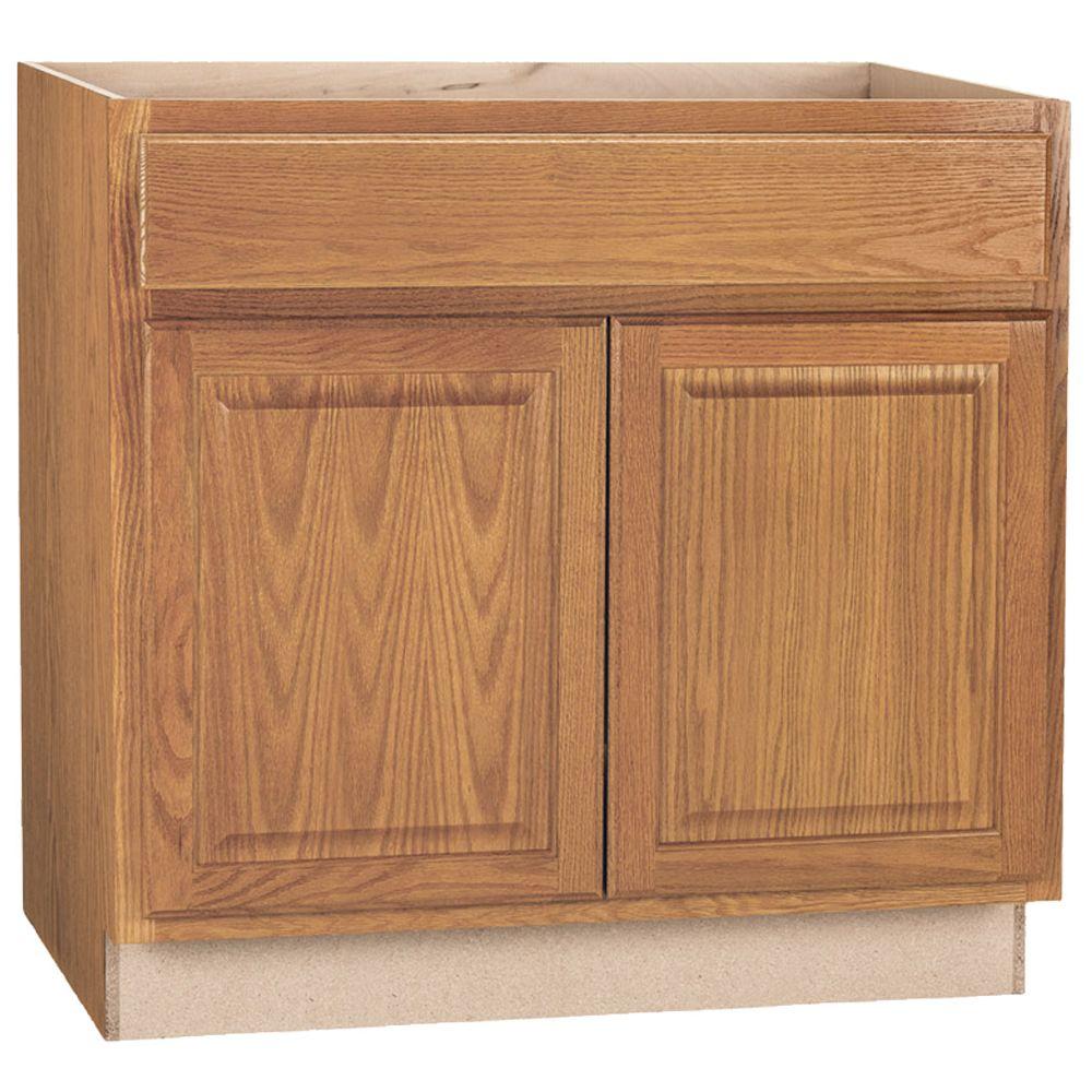 https://images.homedepot-static.com/productImages/828c7949-aaab-4c03-a22d-d0d91eda97a2/svn/medium-oak-hampton-bay-in-stock-kitchen-cabinets-kb36-mo-64_1000.jpg