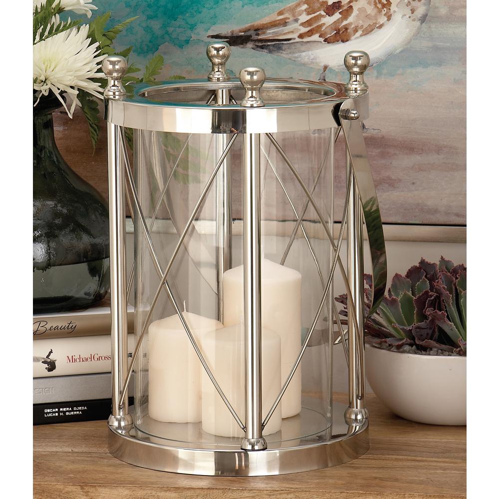 Litton Lane 23 In Silver Stainless Steel And Clear Glass Round Silver Stainless Steel And Clear Glass Round Lantern Candle Holder With Handle 77717 The Home Depot
