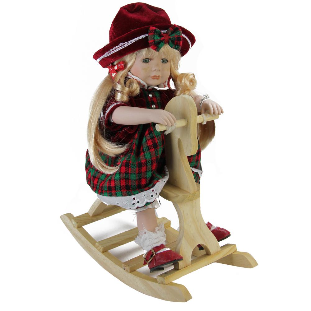 porcelain doll on rocking horse