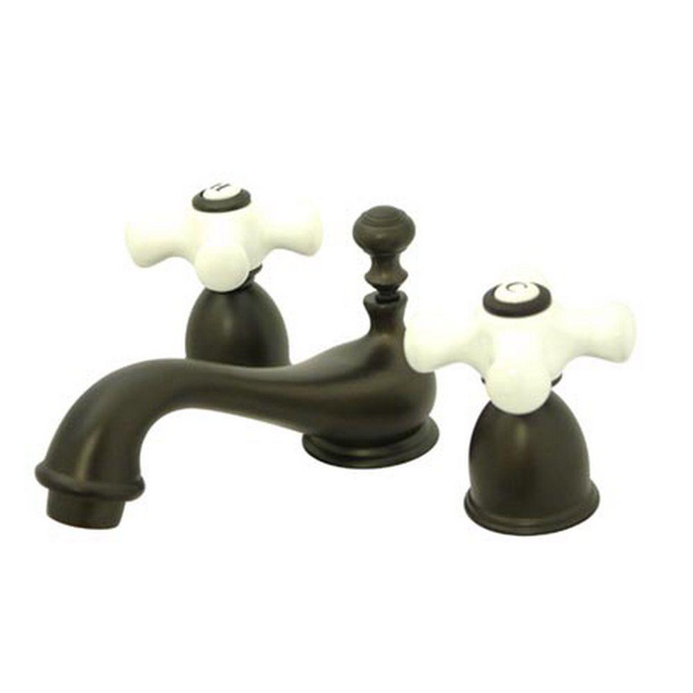Kingston Brass 4 In Minispread 2 Handle Low Arc Bathroom Faucet