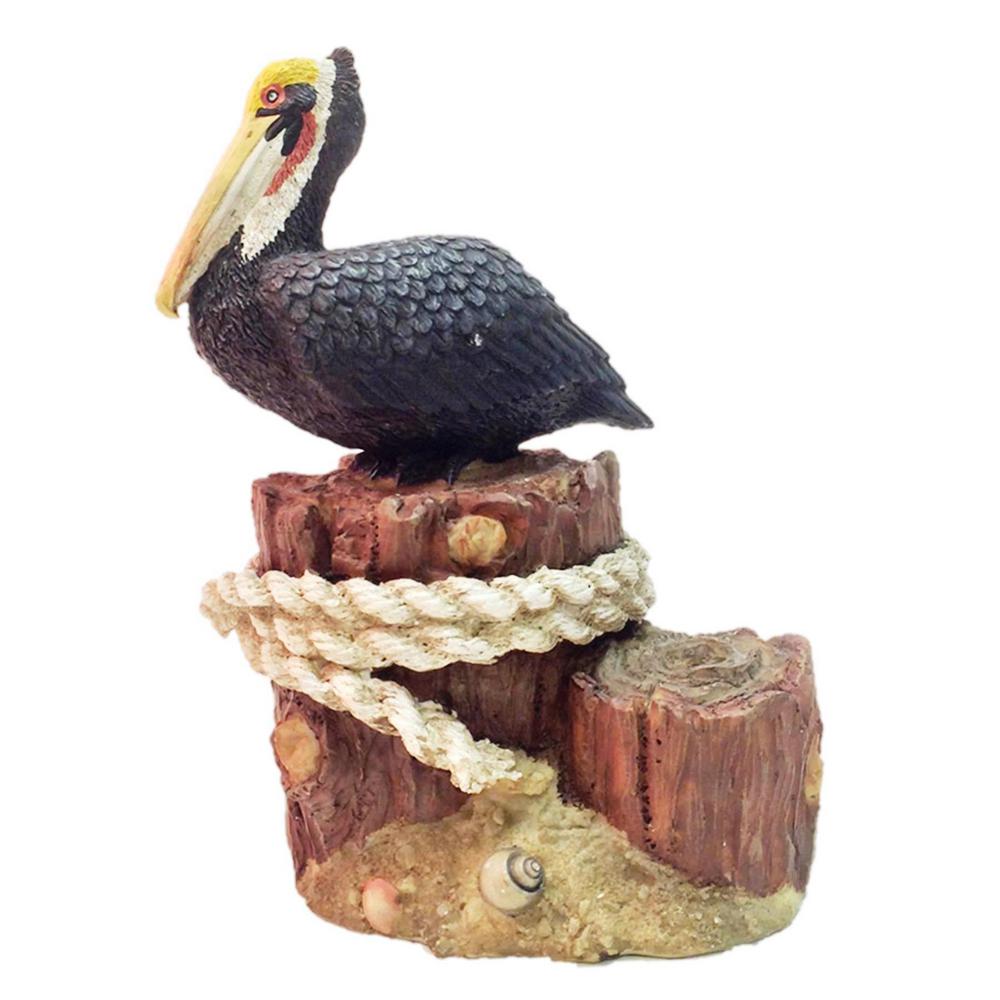Homestyles 8.5 in. Winter Pelican Sitting on Ocean Pier Pillar with
