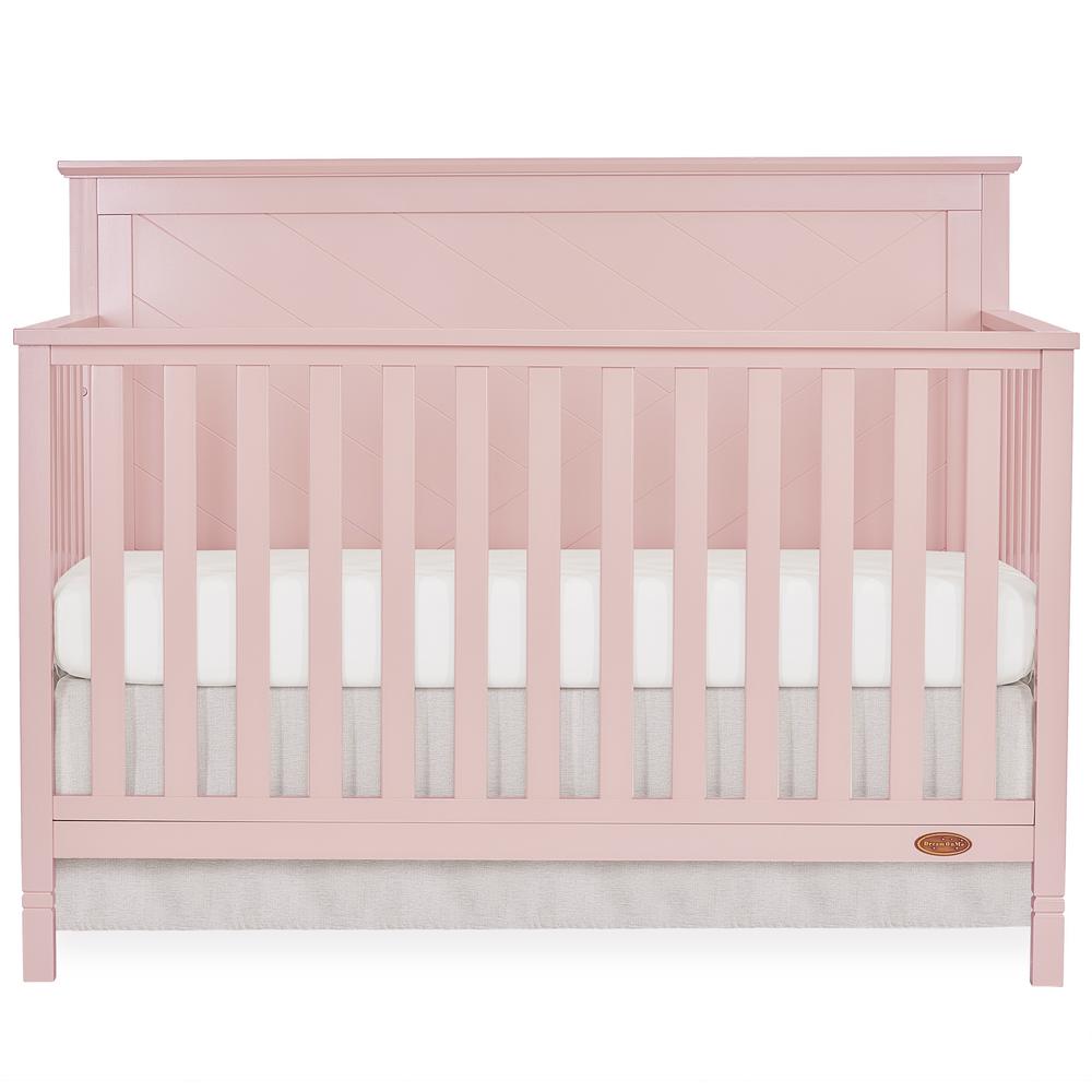 pink crib with changing table