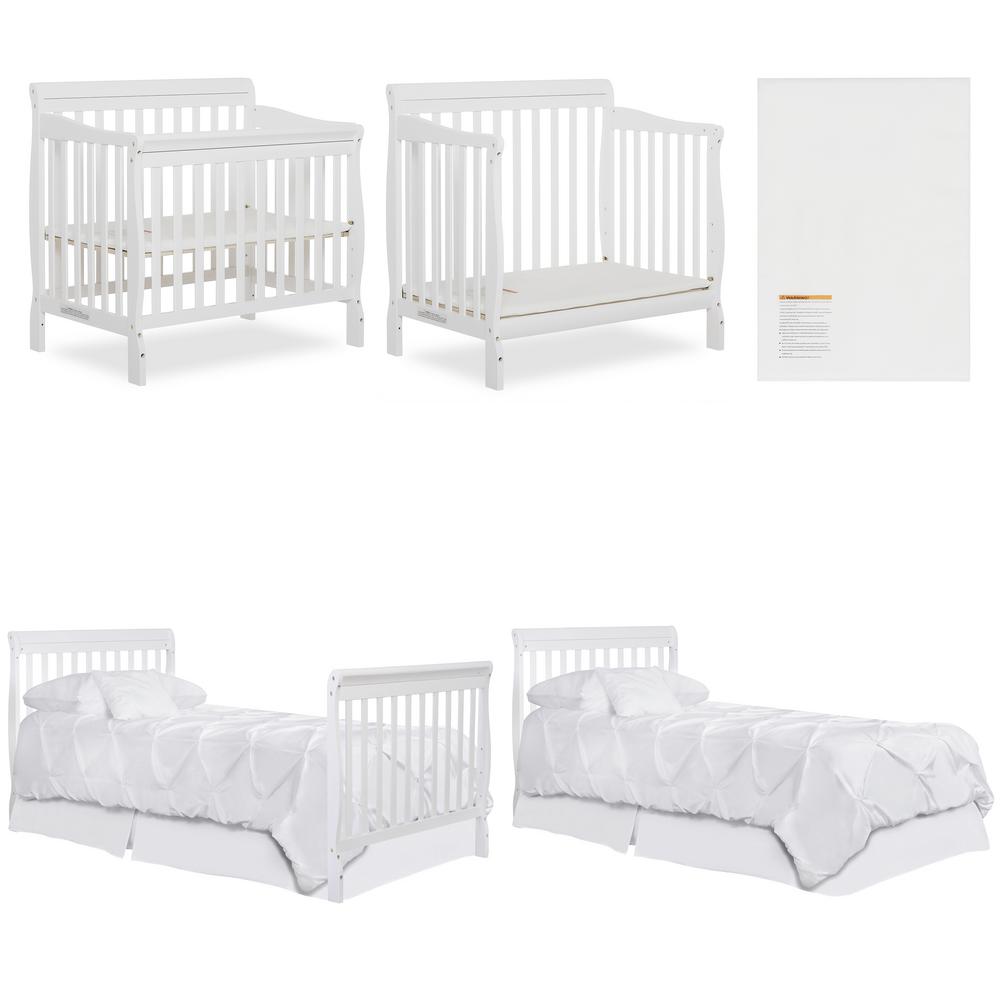 baby in mini crib