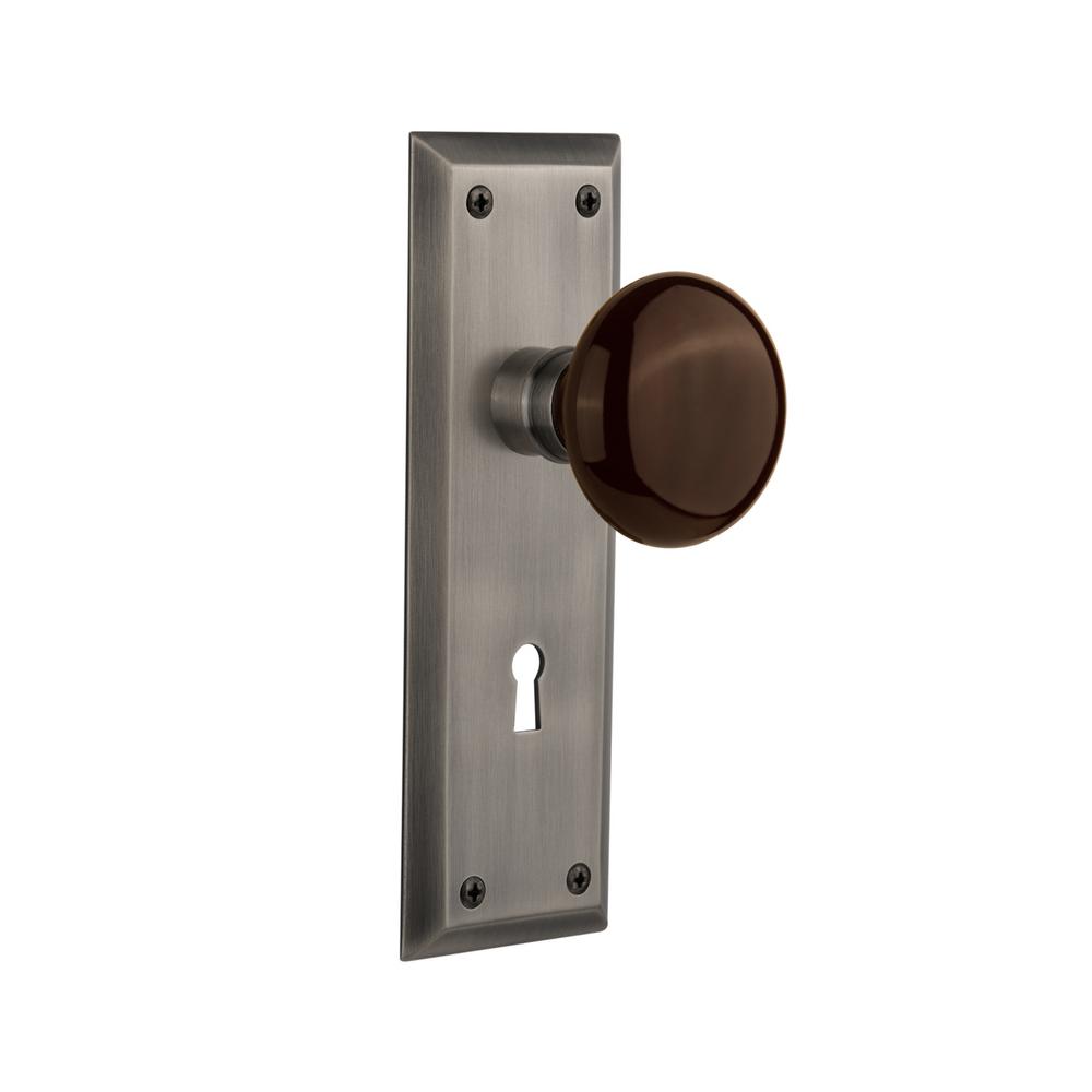 Nostalgic Warehouse New York Plate with Keyhole Single Dummy Brown Porcelain Door Knob in Timeless Bronze