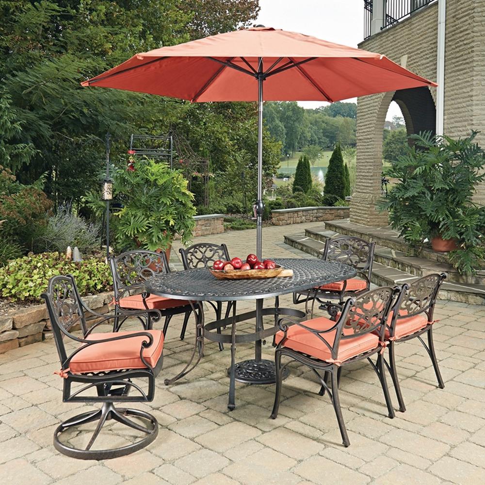 Homestyles Sanibel Rust Bronze 9 Piece Cast Aluminium Oval Outdoor Dining Set With Orange Coral Cushions Umbrella 6655 33856c The Home Depot