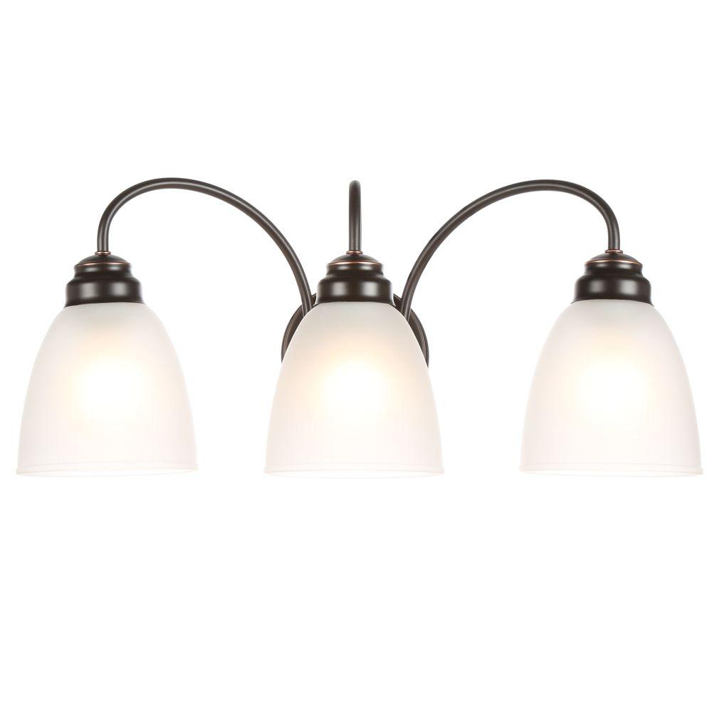 Hampton Bay Hamilton 3 Light Oil Rubbed Bronze Vanity Light With Frosted Glass Shades Efg1393al 2 Orb The Home Depot