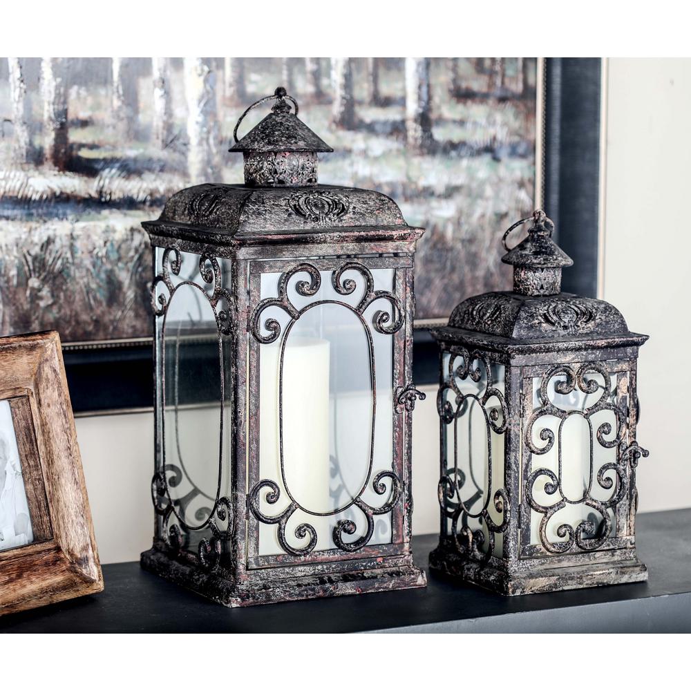 Litton Lane Rustic Distressed Brown Iron And Glass Candle Lantern With Scrollwork Set Of 2 52949 The Home Depot
