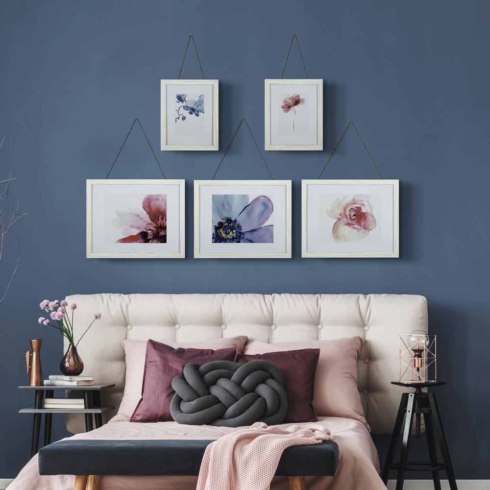 hanging photographs on wall