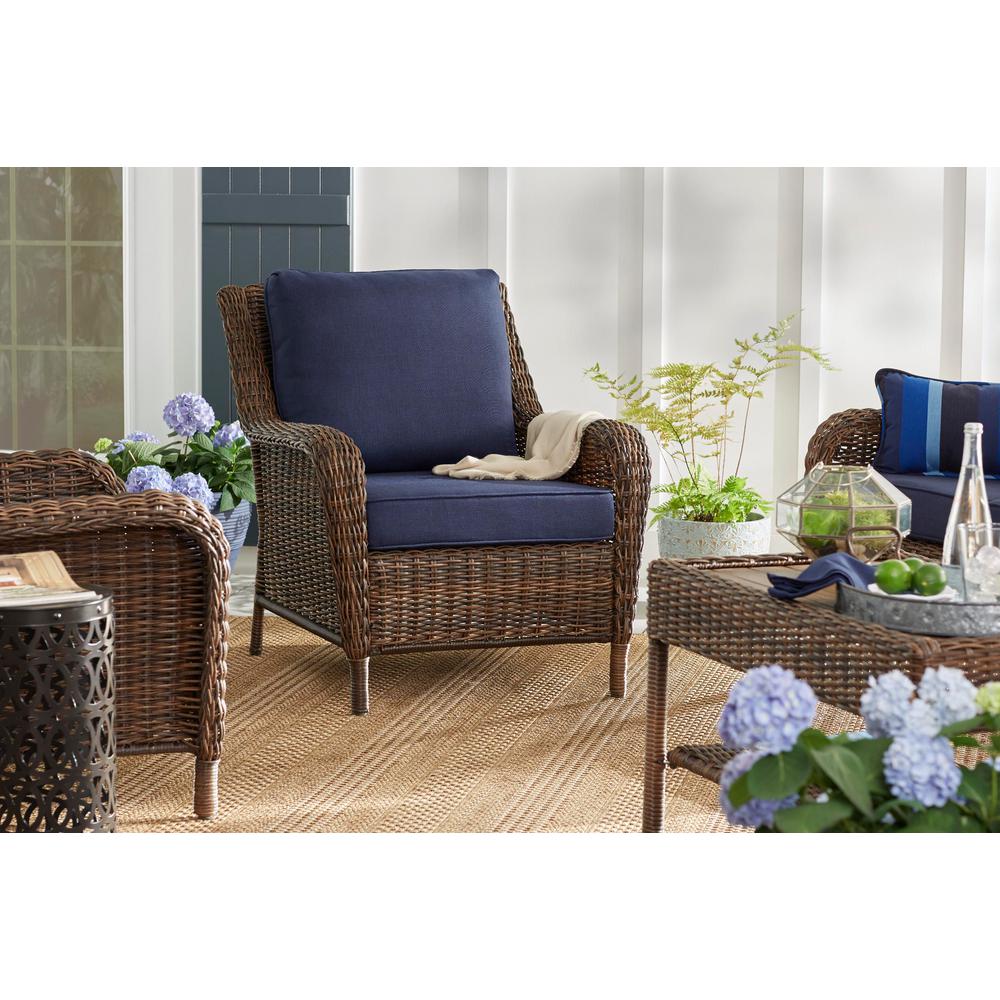 cambridge brown stationary wicker outdoor lounge chair with blue cushions