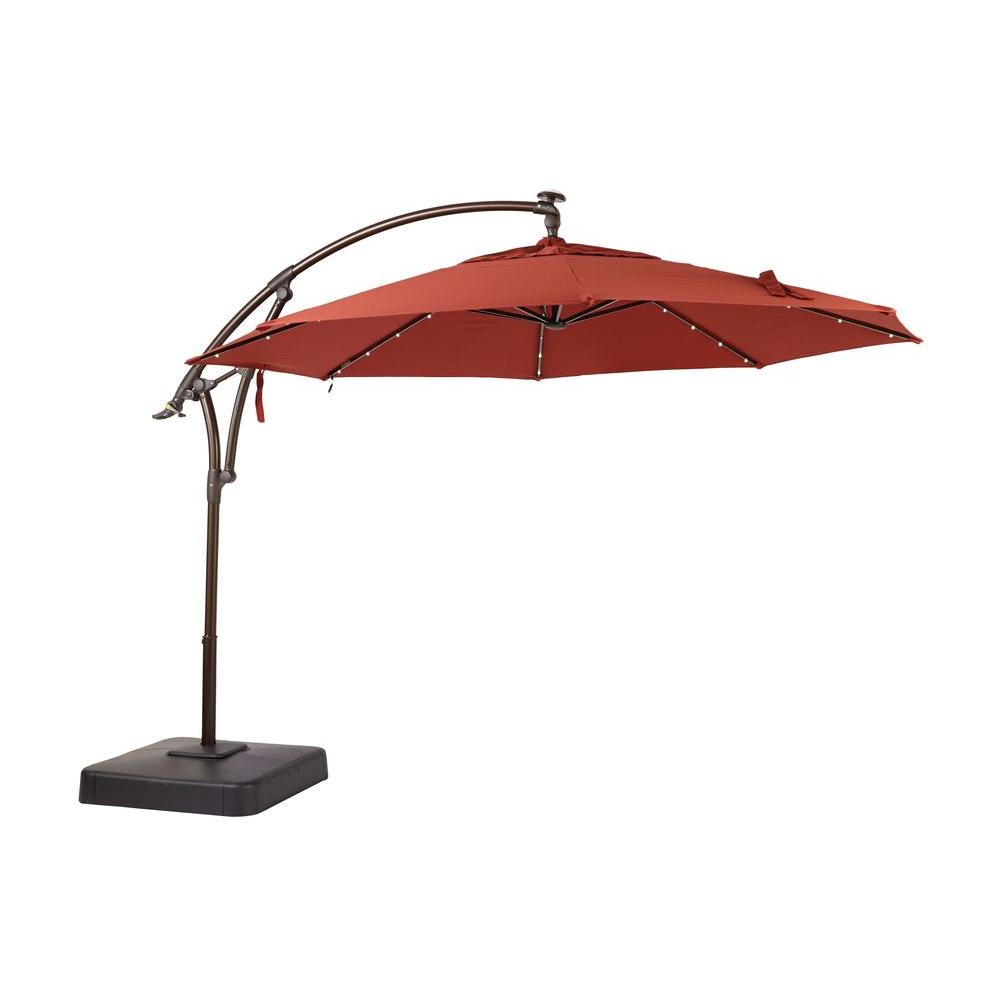 Photo 1 of 11 ft. LED Round Offset Outdoor Patio Umbrella in Sunbrella Henna