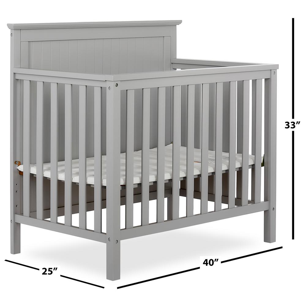 grey mini crib