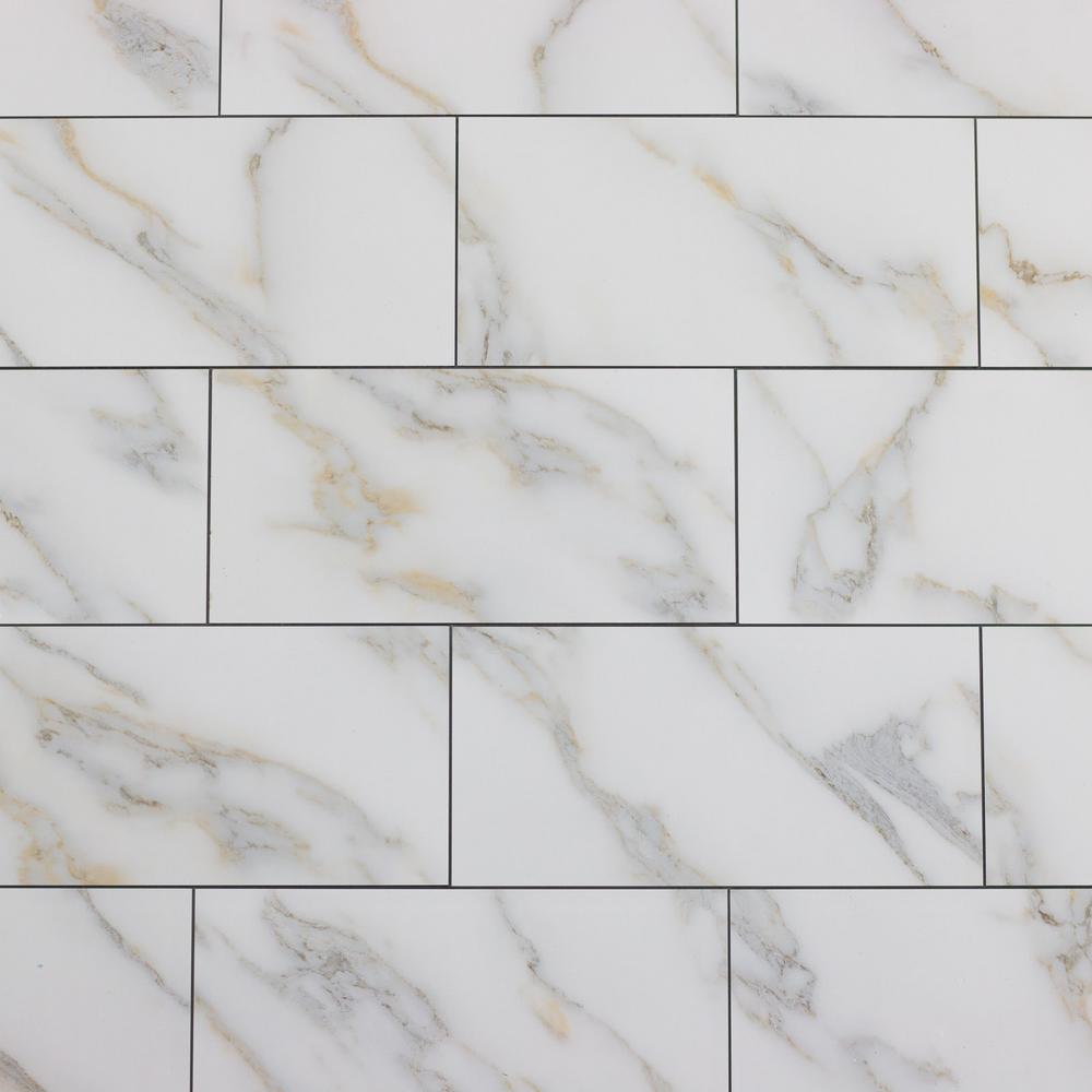 white subway tile with gold trim